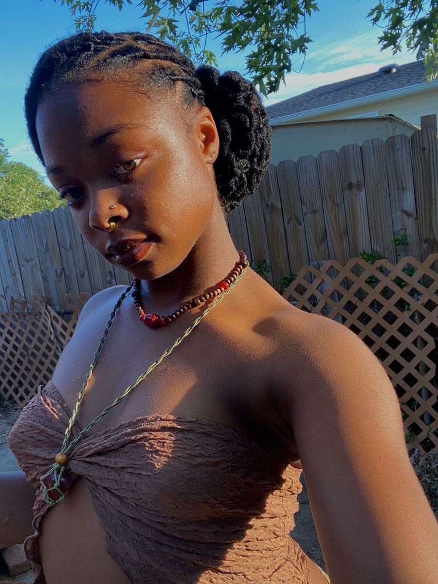 Long locs in a low bun