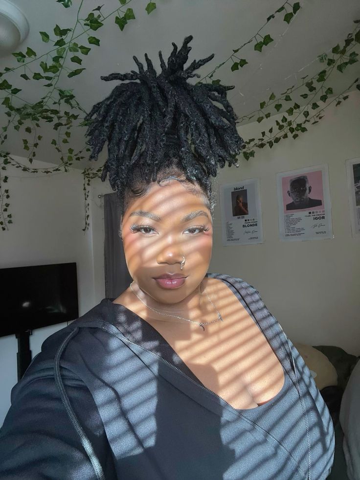A girl posed in her bedroom.