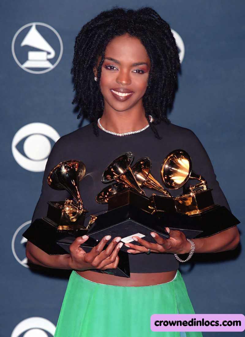 A celebrity holding award