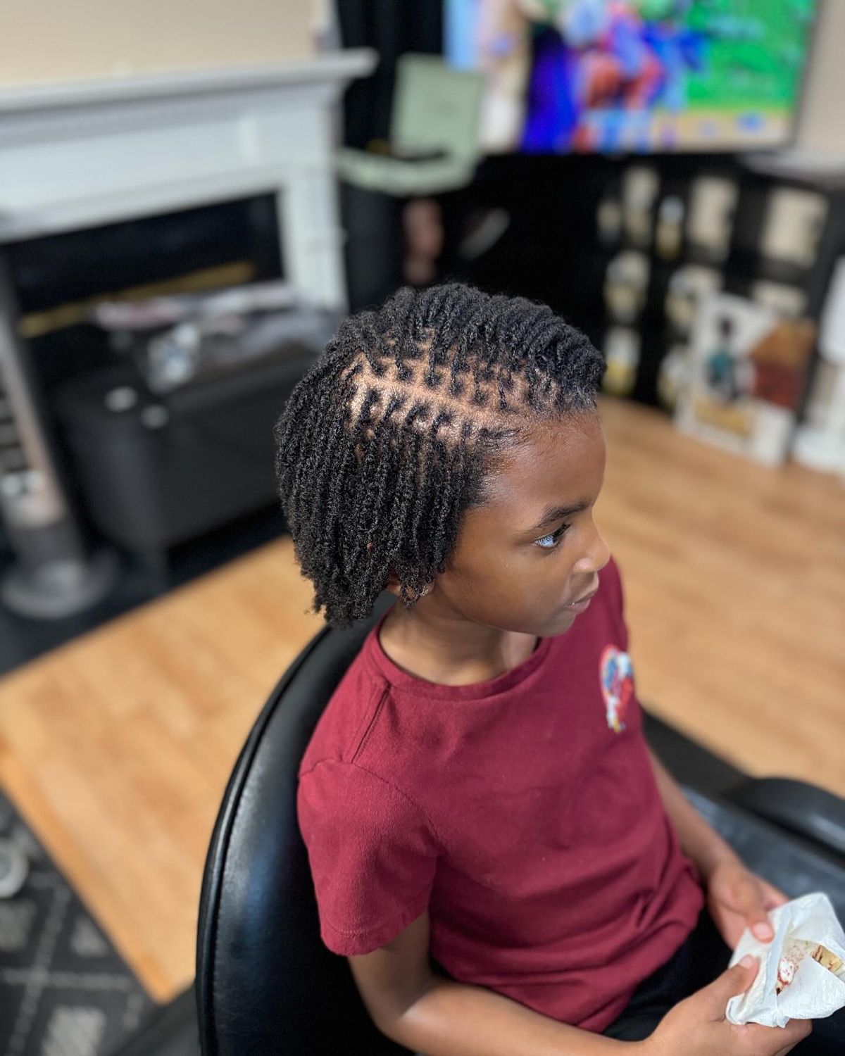 A girl sitting down on locs