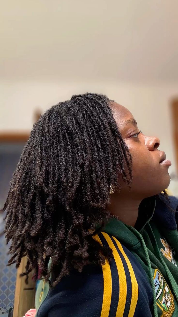 a girl showing off her locs 