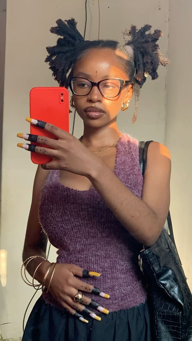 A girl taking a selfie mirror.