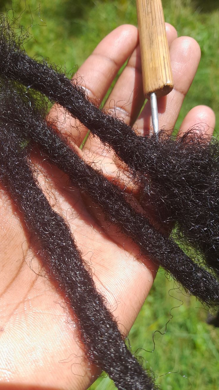 someone showing us her locs repair process