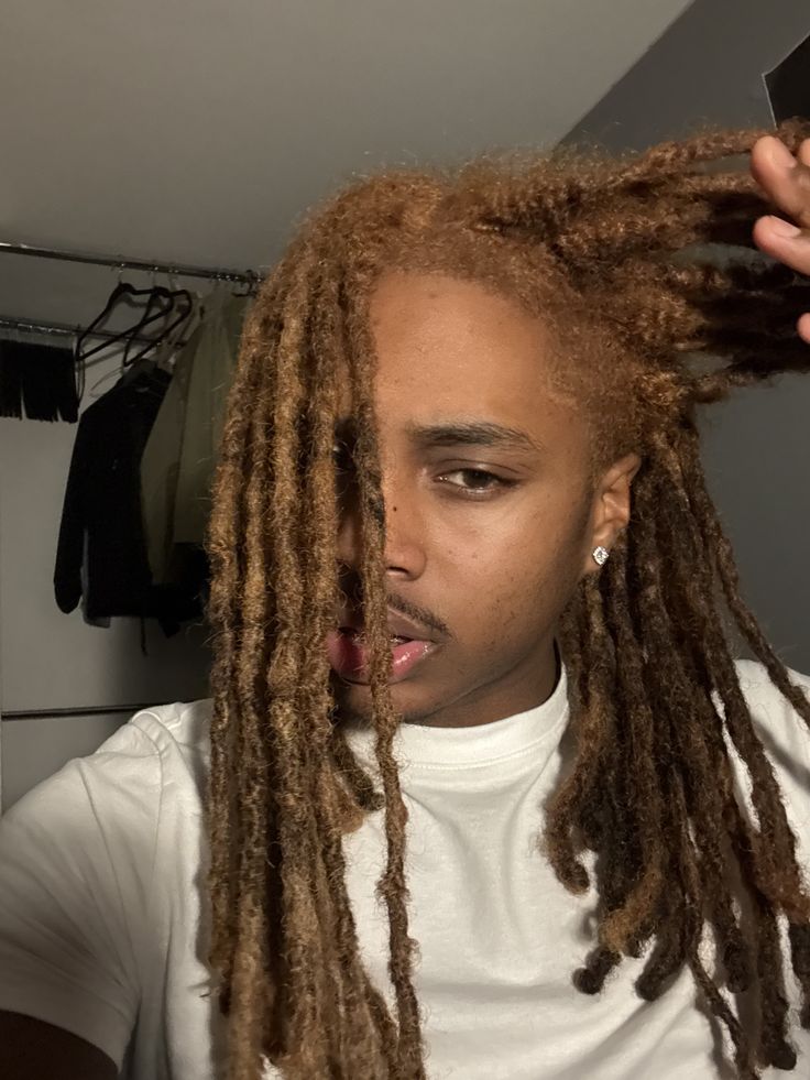 image of a man with brown locs