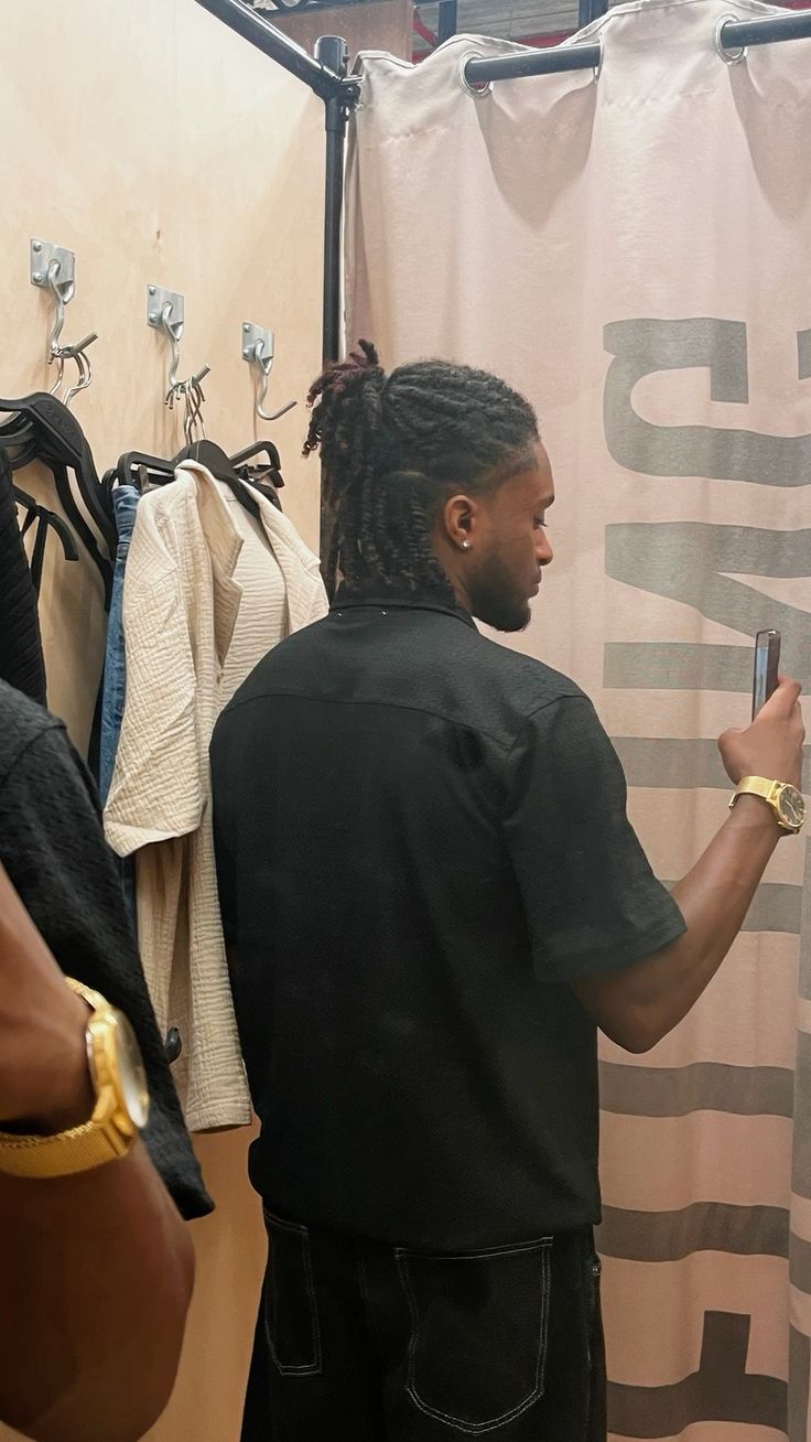 the picture of a man with half up half down locs